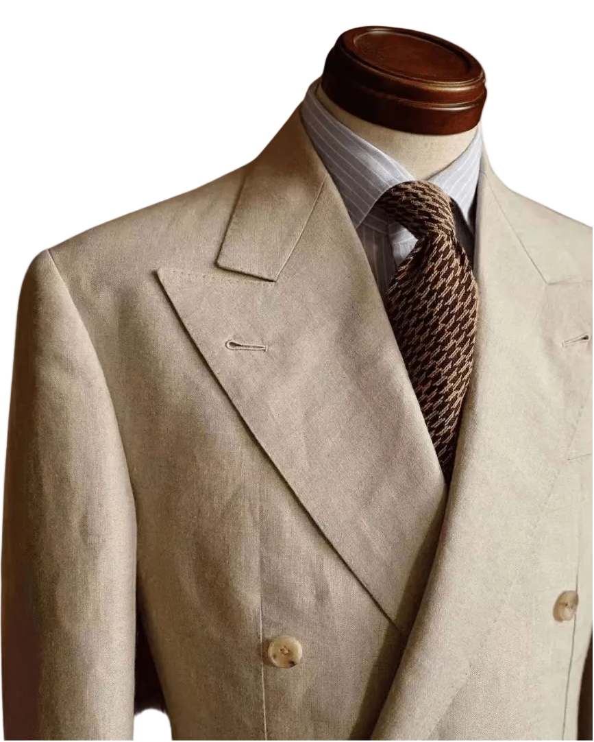 Beige suit jacket with a brown tie on a mannequin against a white background